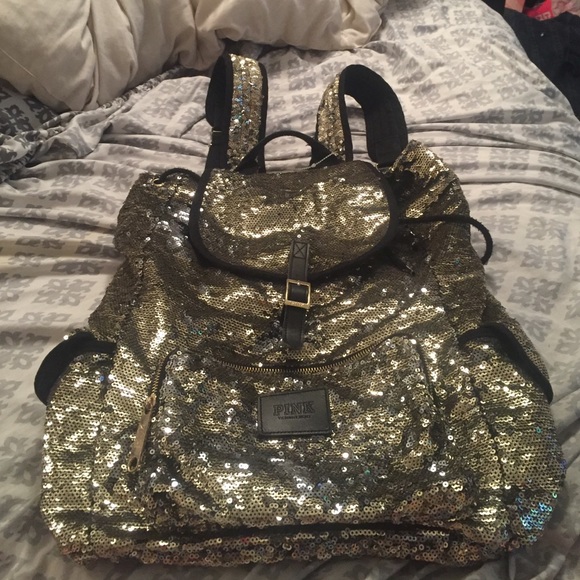 Blinged black and gold backpack by pink.