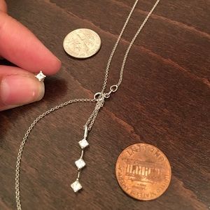 Necklace and single diamond earring