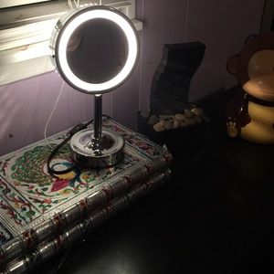 Vanity light two faced round mirror