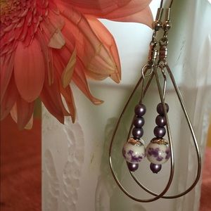 Silver hoop earrings with purple beads
