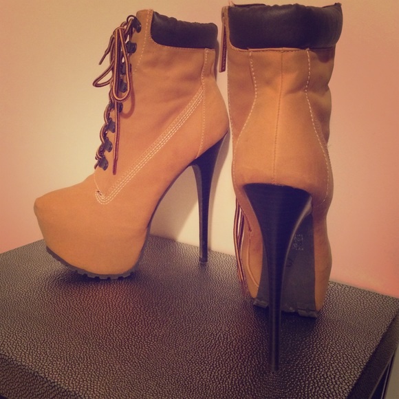 Lace up high heeled boots