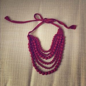 Rust colored fabric beaded necklace. Tie back.