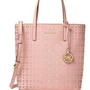 SOLD.               MICHAEL KORS LASER CUT HANDBAG