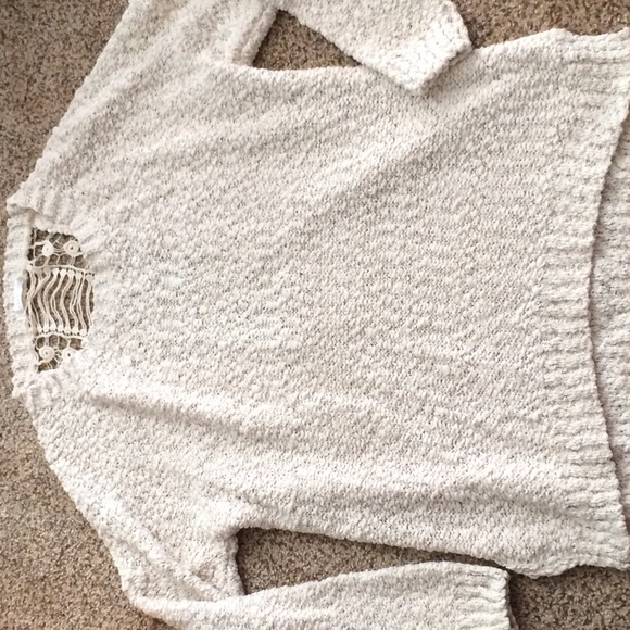 Knitted sweater with detail on back