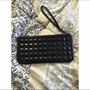 Patent leather studded clutch