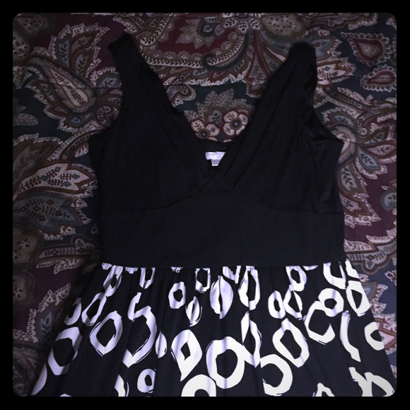 Black silky dress, with circle designs.