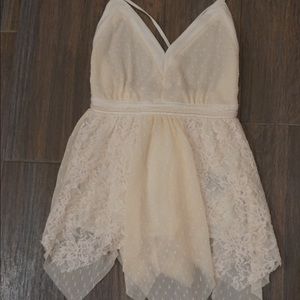 White open back lace top with a V neck