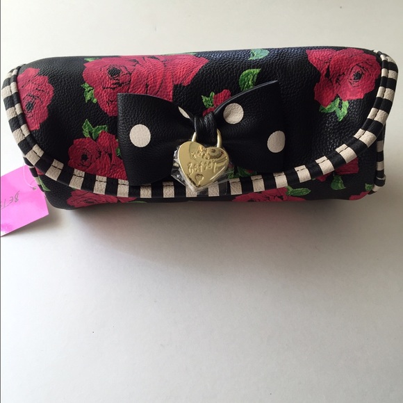 Betsy Johnson round travel pouch.