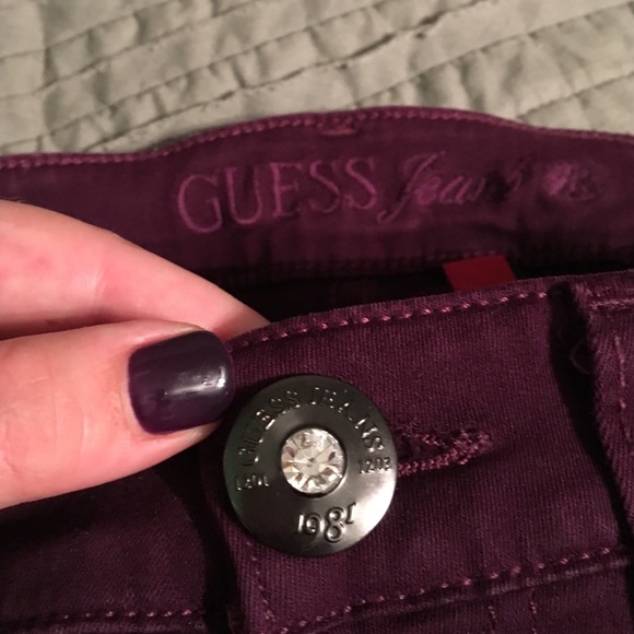 Never worn plum skinny guess jeans.