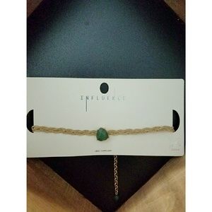 Gold braided choker with emerald stone