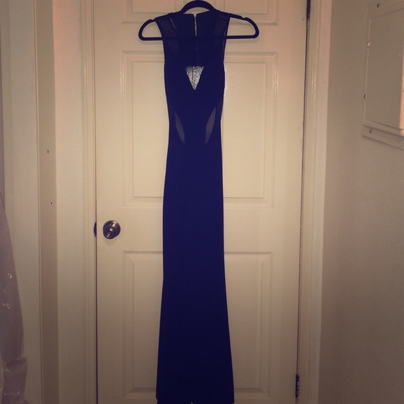 Black open back evening gown with front mesh.