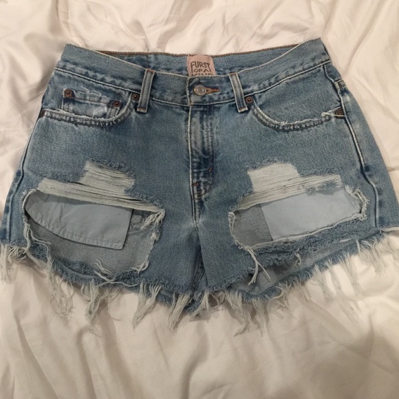 Mid rise ripped denim shorts