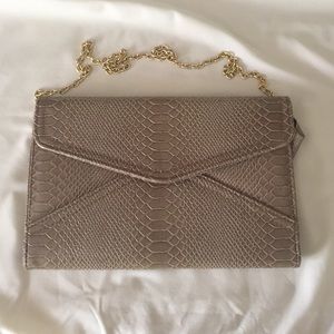 Tan snake skin clutch