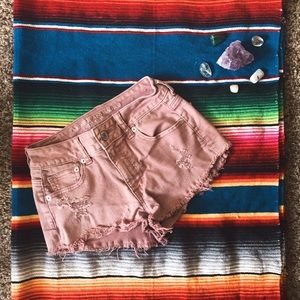 Dusty rose high-waisted distressed shorts