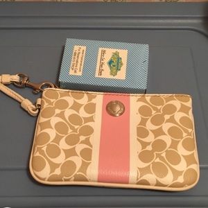 Cute and small coach clutch.