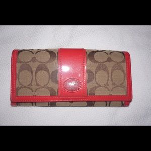 Coach logo with pink wallet