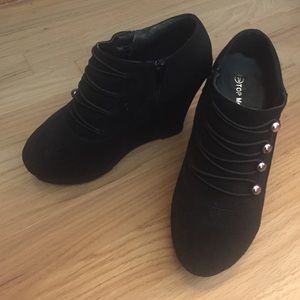 Black wedge booties.