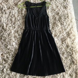 Pleated black dress, sheer top