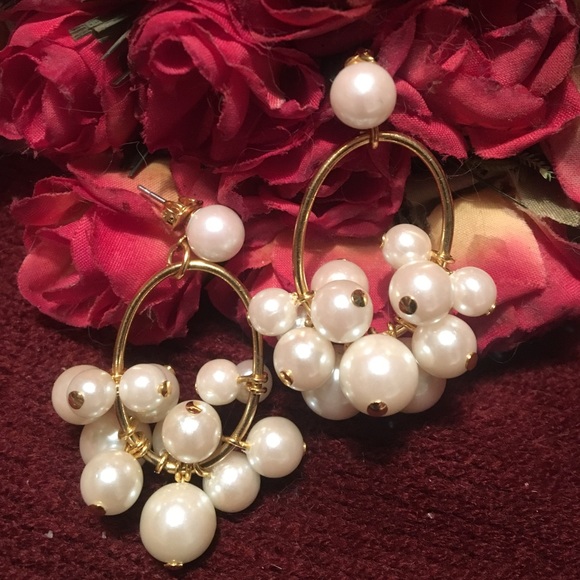 Multiple pearl hanging earrings