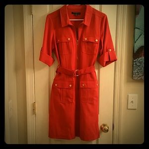 Woman's orange and gold zippered dress