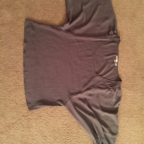 Grey shirt with big poofy sleeves.