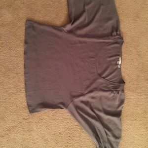 Grey shirt with big poofy sleeves.