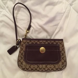 Purple Accent And Brown Coach Wristlet