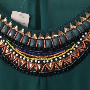Gorgeous green blouse with fun beading detail