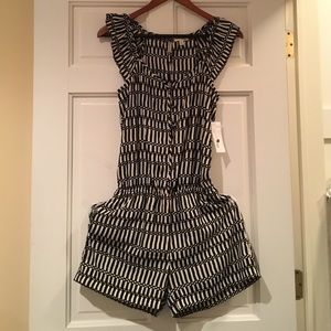 Cute Romper, button down to waist.