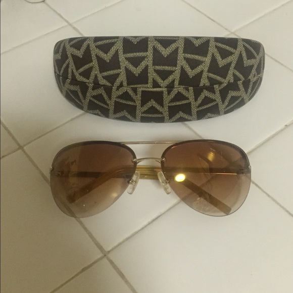 Gold Michael Kors aviator sunglasses.
