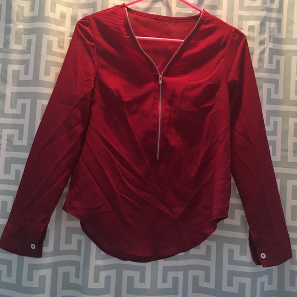 Red zippered blouse.