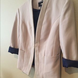 Cream colored blazer with blue lining
