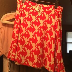 Red-orange and cream skirt