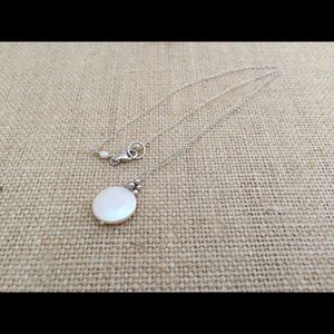 Button pearl pendant on silver chain tiny cluster