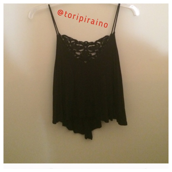 Cute flowy crop top with lace crochet on the back!