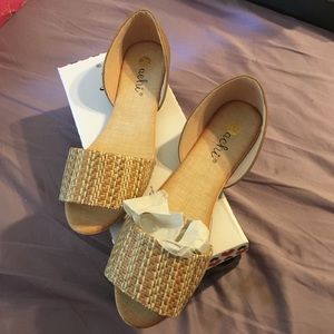 Nude D'Orsay peep toe flat.