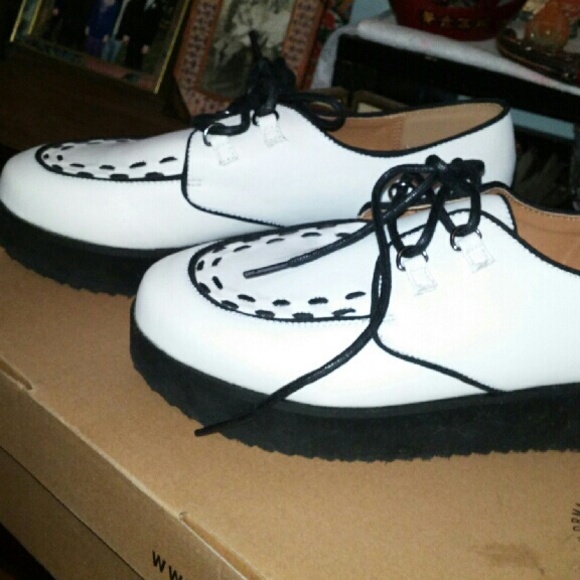 White platform creepers shoes with black stitching