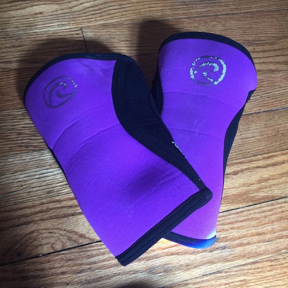 A pair of purple Rehband knee sleeves