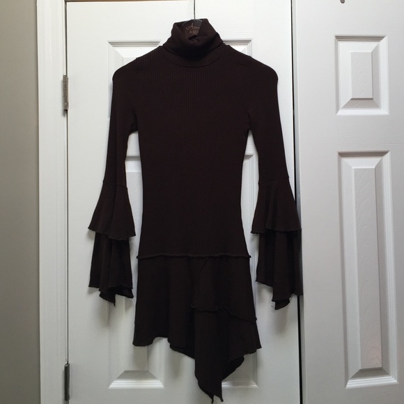Knit turtleneck with skirt and sleeve details.