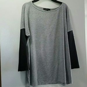 Cotton gray shirt with Pleather sleeves.