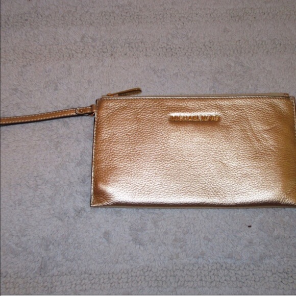 Gold Michael Kors wristlets