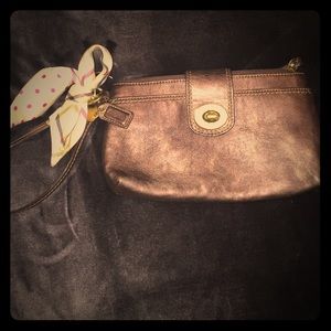 COACH metallic brown wristlet