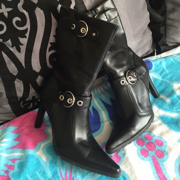 Black mid calf boots with silver buckle.