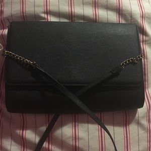Black crossbody bag with gold chain strap