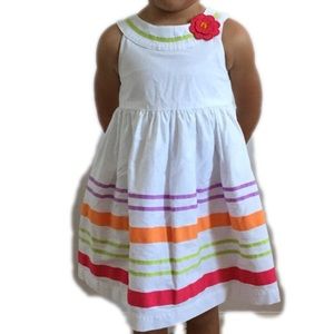 White toddler dress with multi color stripes