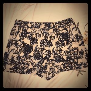 Black/cream floral shorts.