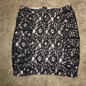 Black lace pencil skirt with light pink underlay