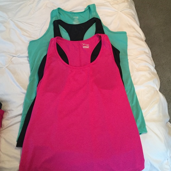 Semi fitted Workout tops. No visible wear.