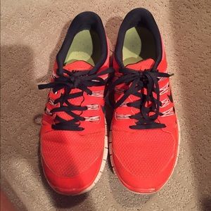 Reddish orange & black nike frees