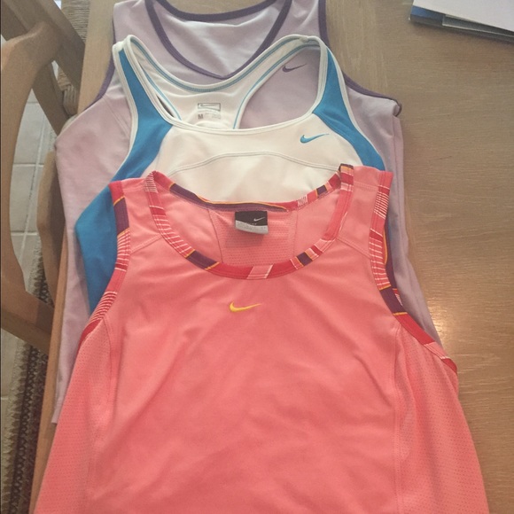 Size medium Nike tennis tanks. Fits like S/XS.